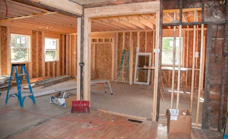 A remodeled basement with comfy seating, bright lighting, and a play area for kids and adults.